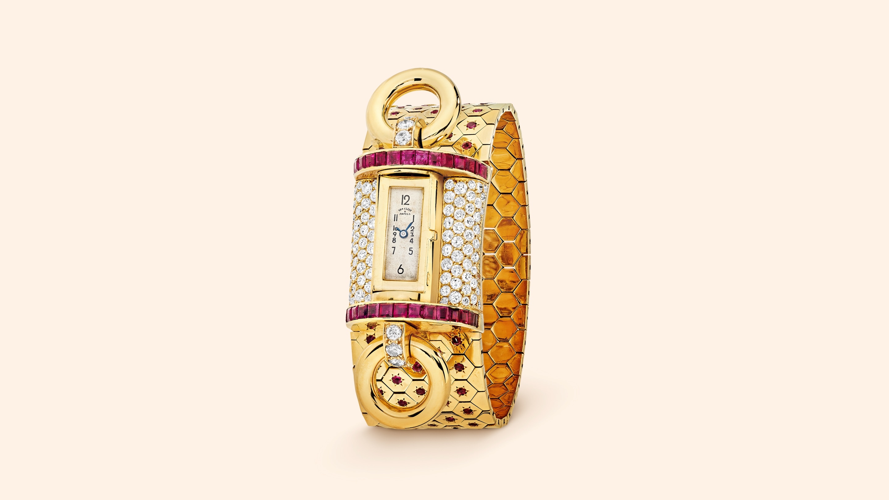 Ludo Tourniquet wristwatch, 1937. 18K yellow gold, rubies, diamonds. Van Cleef & Arpels Collection.