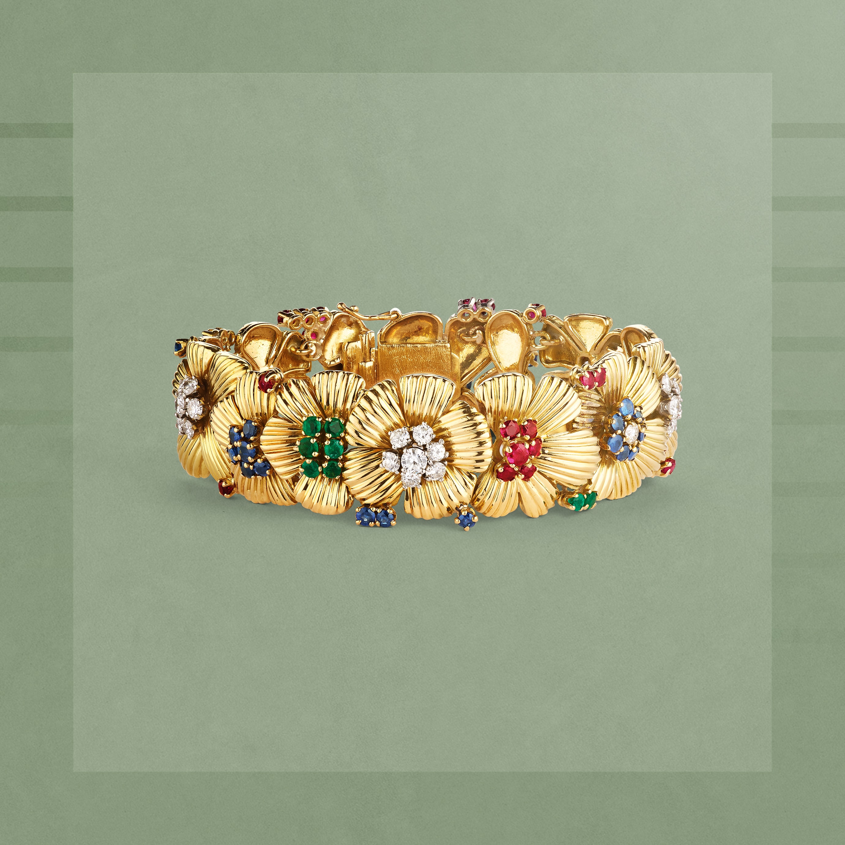 Flower bracelet, 1950-1954. 18K yellow gold, emeralds, rubies, sapphires, diamonds. Van Cleef & Arpels Collection.