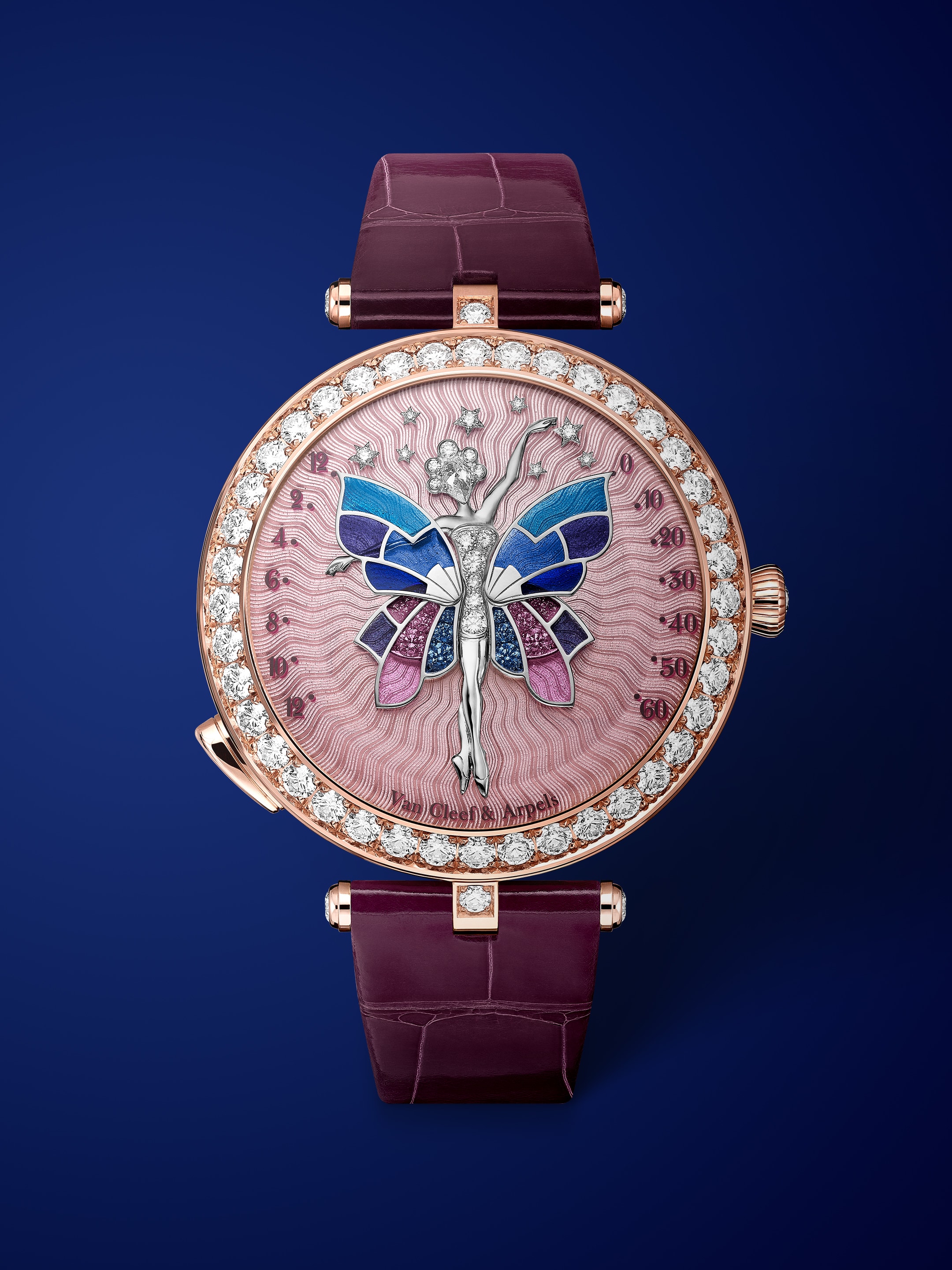 Lady Arpels Ballerine Enchantée Or Rose watch, 18K rose gold, rhodium plated 18K white gold, diamonds, enamel, self-winding mechanical movement equipped with a retrograde time on demand module. Watch sold with two interchangeable straps and one interchangeable pin buckle set with diamonds. Poetic Complications Collection, Van Cleef & Arpels.