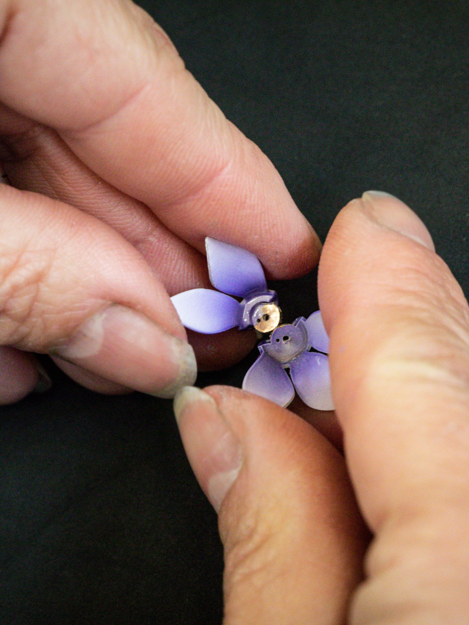 Assembling a cyclamen flower. Extraordinary Objects collection, Van Cleef & Arpels.